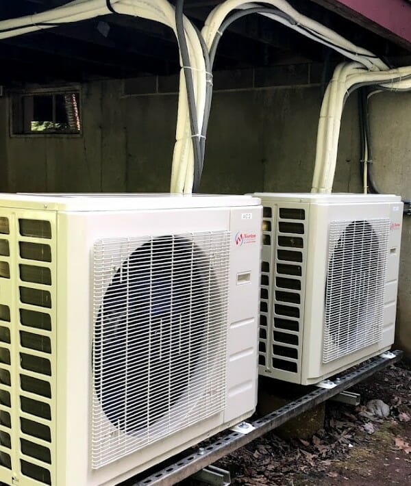 Two outdoor ductless HVAC systems under deck